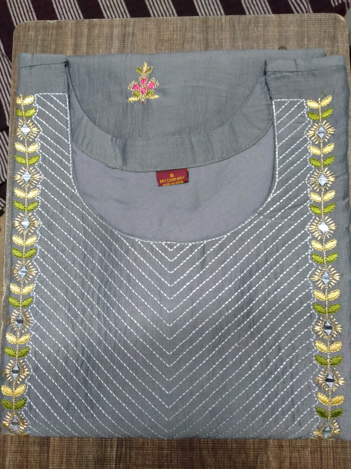 Grey embroidered garment